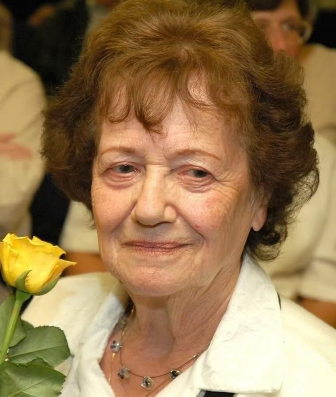 Dita at a memorial for her mother